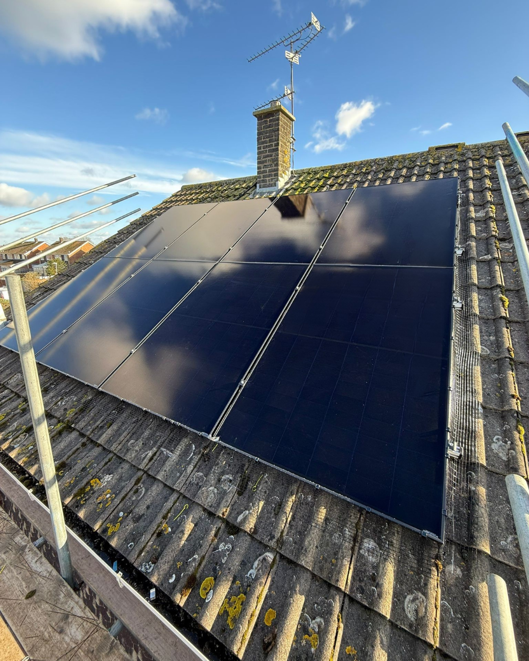 Solar panels installed on the pitched roof of a UK home.