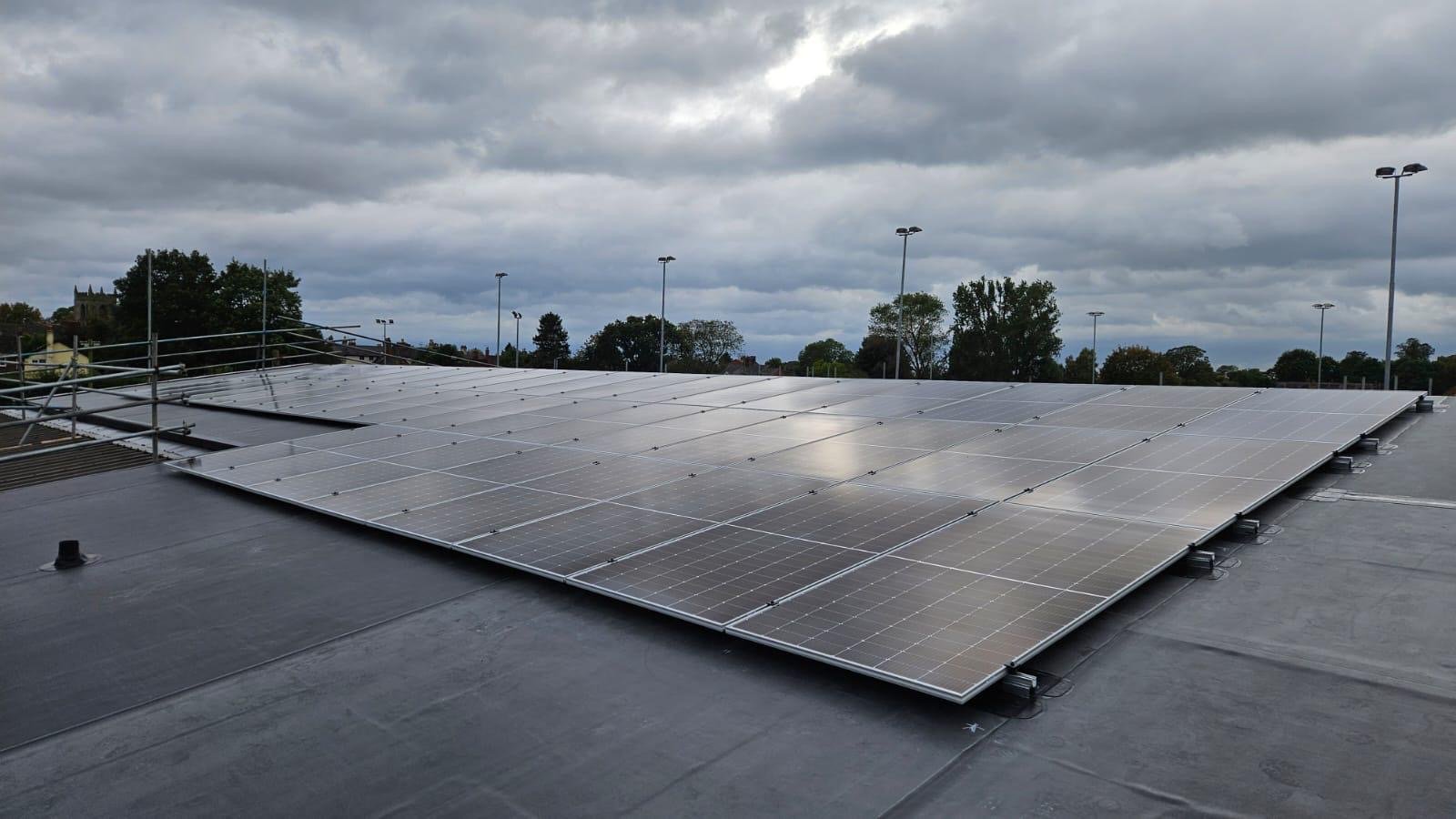 Domestic solar installation with safe scaffolding around a UK home
