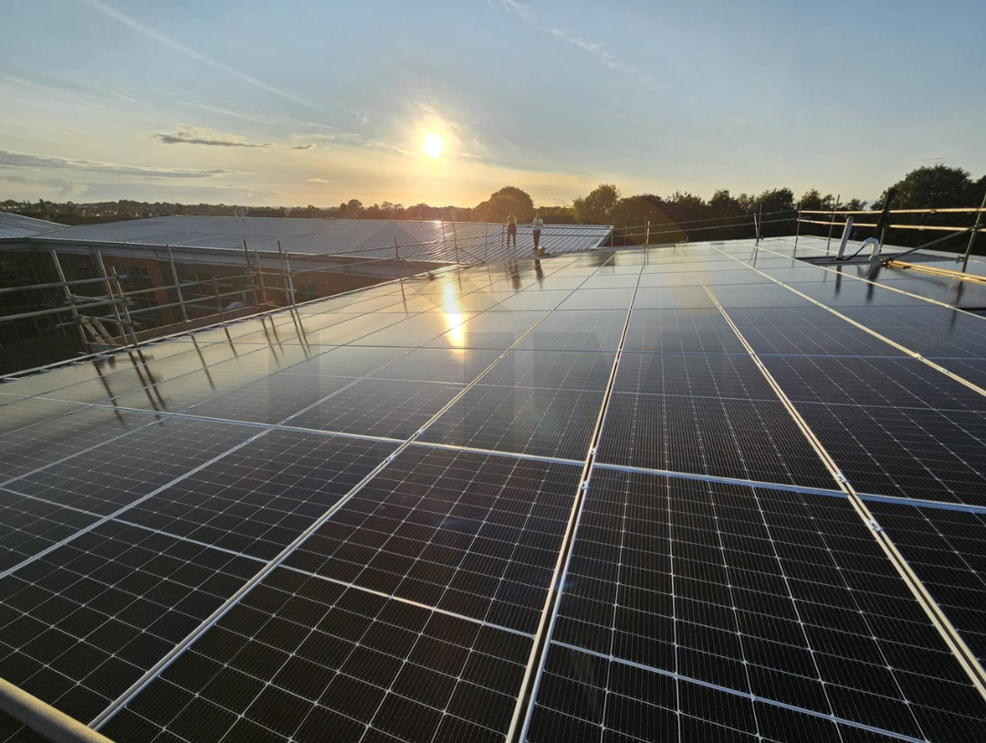 Competent solar installation team working safely on a residential roof